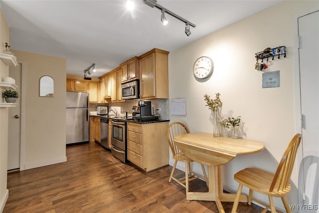 849 Delaware Ave Unit 205, Buffalo, NY 14209 - kitchen with stainless steel appliances, track lighting, dark wood-type flooring, and dark countertops
