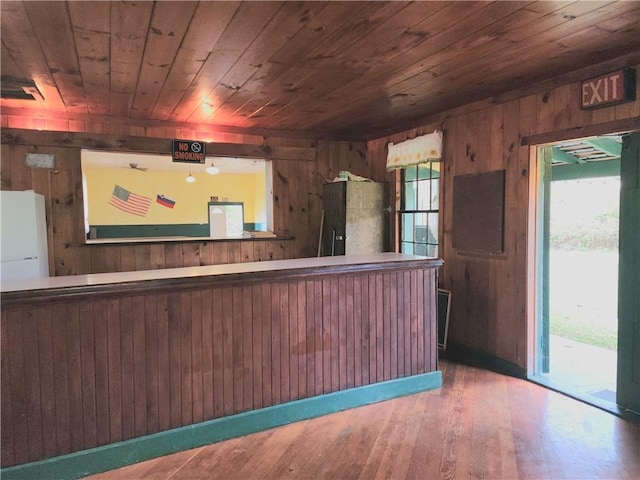 655 County Highway 26, Otsego, NY 13337 - kitchen with wooden walls, wood ceiling, and hardwood / wood-style flooring