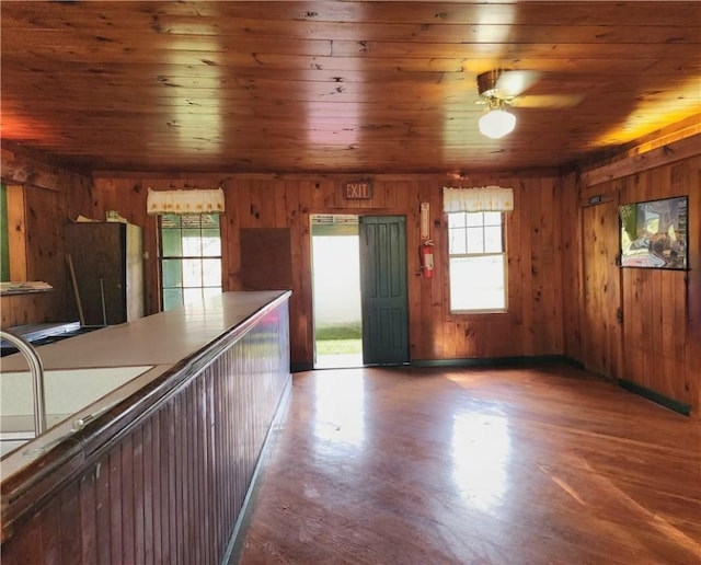 655 County Highway 26, Otsego, NY 13337 - kitchen featuring wooden walls, healthy amount of natural light, wood finished floors, wooden ceiling, and ceiling fan