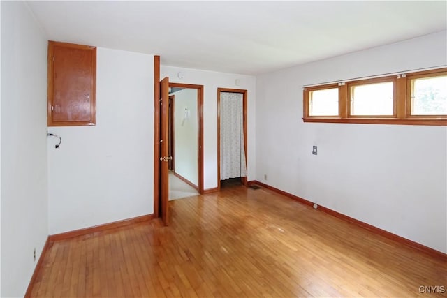 6341 Number Four Rd, Watson, NY 13367 - empty room featuring light wood-style floors, plenty of natural light, and baseboards
