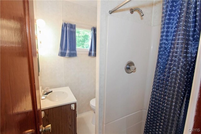 6341 Number Four Rd, Watson, NY 13367 - full bath with vanity, a shower with shower curtain, toilet, and tile walls
