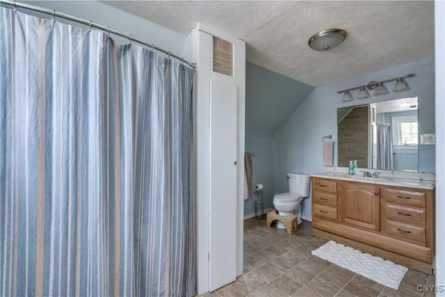 621 N Hycliff Dr, Watertown-City, NY 13601 - bathroom with toilet, vanity, vaulted ceiling, a textured ceiling, and curtained shower