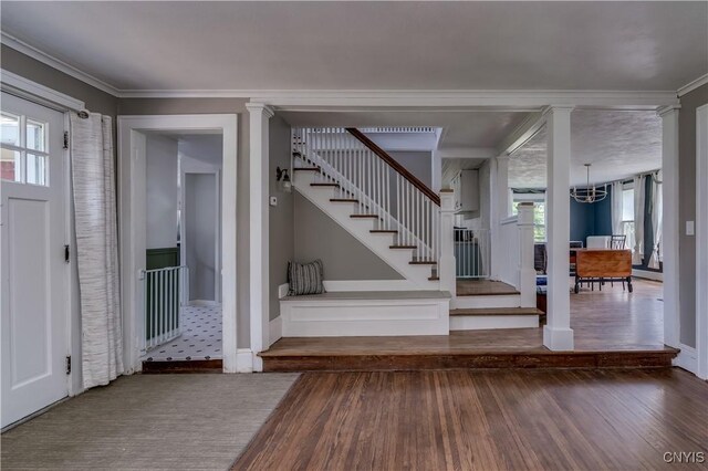 621 N Hycliff Dr, Watertown-City, NY 13601 - foyer featuring wood finished floors, stairs, ornamental molding, baseboards, and a chandelier