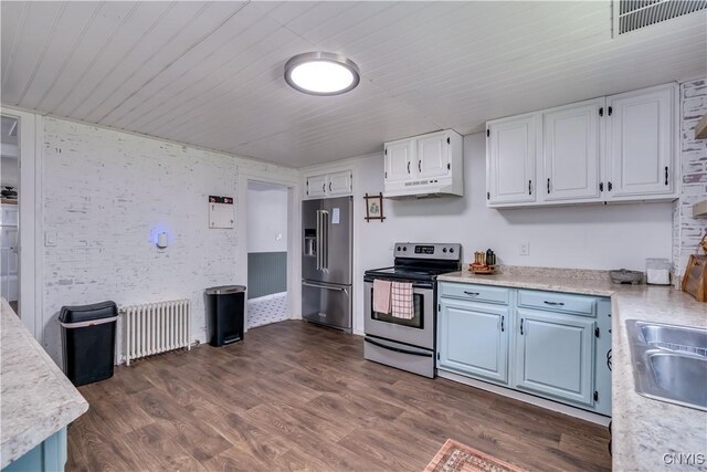 621 N Hycliff Dr, Watertown-City, NY 13601 - kitchen with stainless steel appliances, radiator, light countertops, under cabinet range hood, and wood ceiling