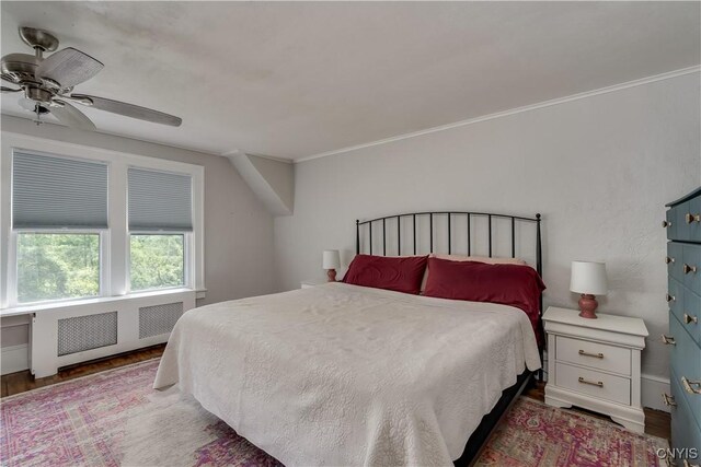 621 N Hycliff Dr, Watertown-City, NY 13601 - bedroom featuring wood finished floors, a ceiling fan, crown molding, and radiator heating unit