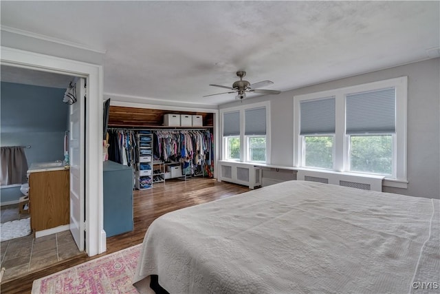 621 N Hycliff Dr, Watertown-City, NY 13601 - bedroom with a closet, ceiling fan, wood finished floors, and radiator
