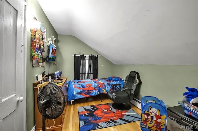 283 W Tupper St, Buffalo, NY 14201 - bedroom featuring lofted ceiling, wood finished floors, and a baseboard radiator