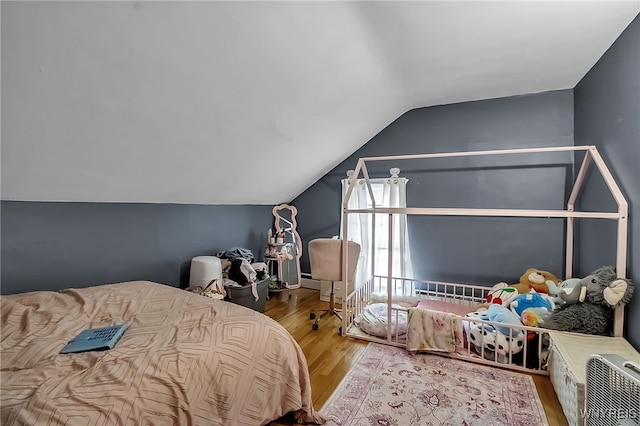 283 W Tupper St, Buffalo, NY 14201 - bedroom featuring wood finished floors and lofted ceiling