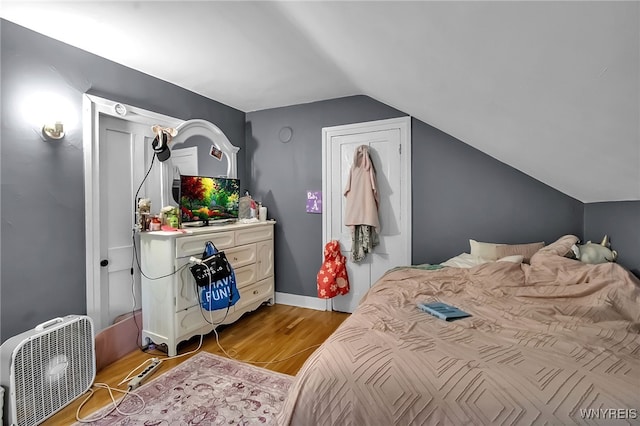 283 W Tupper St, Buffalo, NY 14201 - bedroom featuring lofted ceiling and wood finished floors
