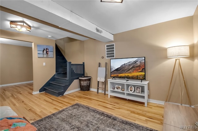 283 W Tupper St, Buffalo, NY 14201 - living area featuring wood finished floors, baseboards, and stairway