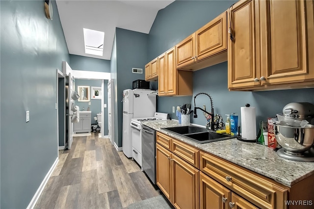 283 W Tupper St, Buffalo, NY 14201 - kitchen with a skylight, a sink, light wood finished floors, dishwasher, and baseboards