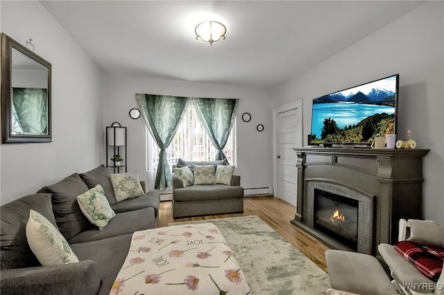 283 W Tupper St, Buffalo, NY 14201 - living room with a baseboard radiator, light wood-style floors, and a warm lit fireplace