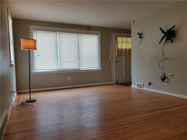 526 Winchester St, Rochester, NY 14615 - empty room featuring light wood-style floors, plenty of natural light, and baseboards