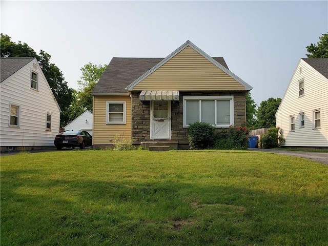 526 Winchester St, Rochester, NY 14615 - bungalow with stone siding and a front yard