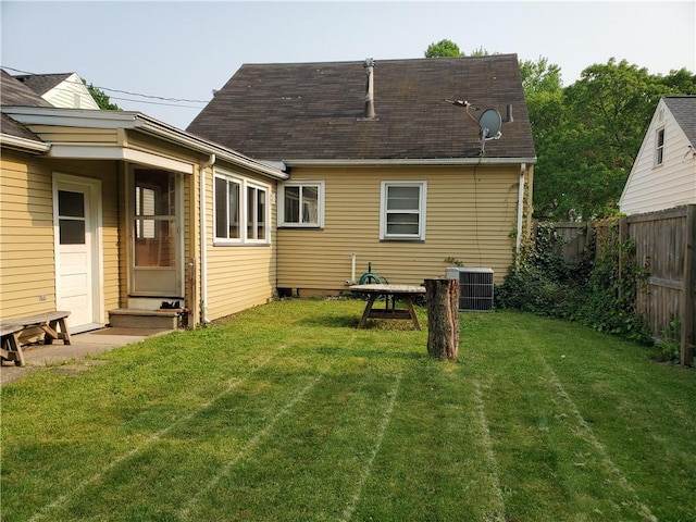 526 Winchester St, Rochester, NY 14615 - back of property with entry steps, central air condition unit, and roof with shingles
