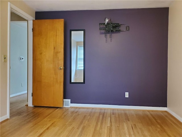 526 Winchester St, Rochester, NY 14615 - spare room featuring wood finished floors and baseboards