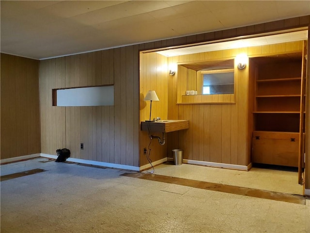 526 Winchester St, Rochester, NY 14615 - unfurnished living room with baseboards, wooden walls, and carpet flooring