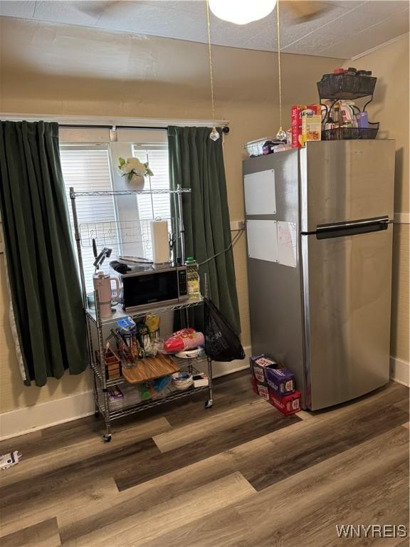 44 Freeman St, Buffalo, NY 14215 - kitchen with stainless steel appliances, wood finished floors, and baseboards