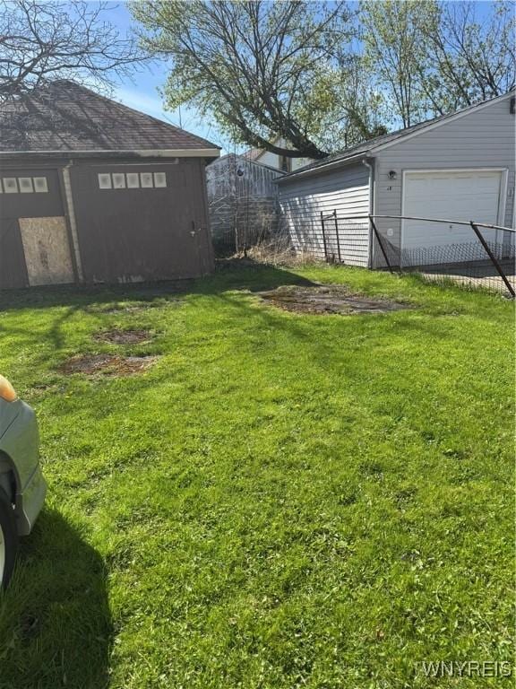 44 Freeman St, Buffalo, NY 14215 - view of yard featuring a detached garage