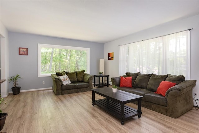 25 Highland Dr, Corning-City, NY 14830 - living room with light wood-style floors, baseboard heating, and baseboards