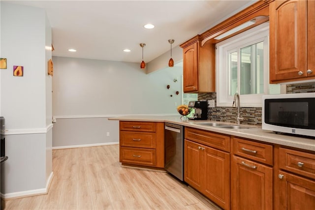 25 Highland Dr, Corning-City, NY 14830 - kitchen with dishwasher, white microwave, a sink, tasteful backsplash, and light wood finished floors