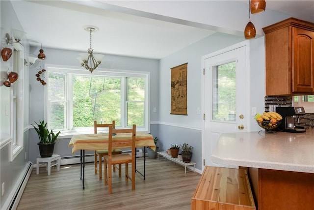 25 Highland Dr, Corning-City, NY 14830 - dining space with a baseboard radiator, plenty of natural light, a chandelier, and light wood-style floors