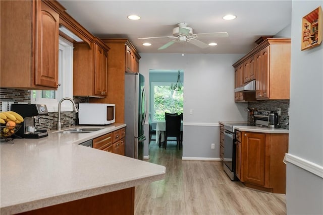 25 Highland Dr, Corning-City, NY 14830 - kitchen featuring appliances with stainless steel finishes, a sink, ceiling fan, under cabinet range hood, and light countertops
