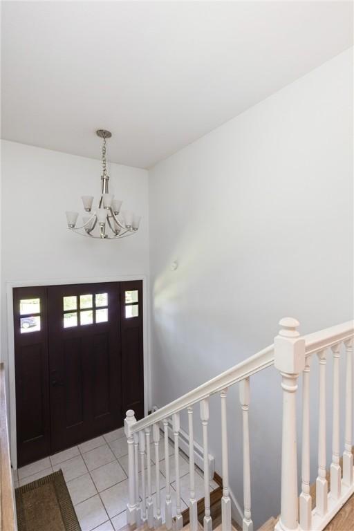 25 Highland Dr, Corning-City, NY 14830 - foyer entrance featuring a chandelier and light tile patterned floors