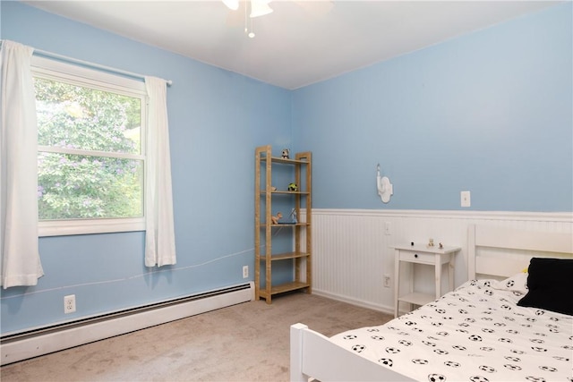 25 Highland Dr, Corning-City, NY 14830 - bedroom featuring a baseboard radiator, carpet flooring, a wainscoted wall, and ceiling fan