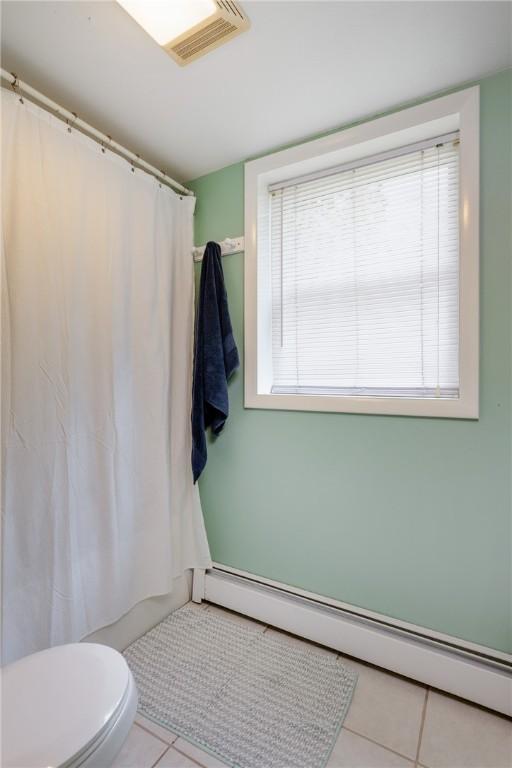 25 Highland Dr, Corning-City, NY 14830 - bathroom with baseboard heating, tile patterned flooring, toilet, and a shower with shower curtain
