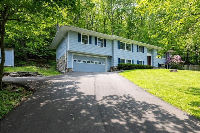 25 Highland Dr, Corning-City, NY 14830 - raised ranch with driveway, a garage, and a front yard