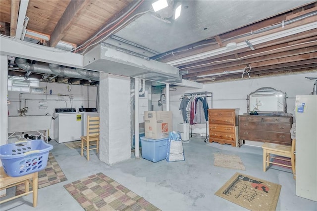 350 Colebourne Rd, Rochester, NY 14609 - unfinished below grade area featuring a sink, washer and clothes dryer, and heating unit