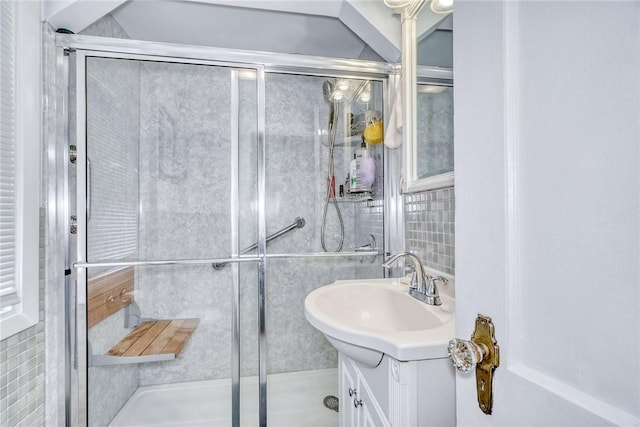 350 Colebourne Rd, Rochester, NY 14609 - full bath featuring vanity, a stall shower, and tile walls