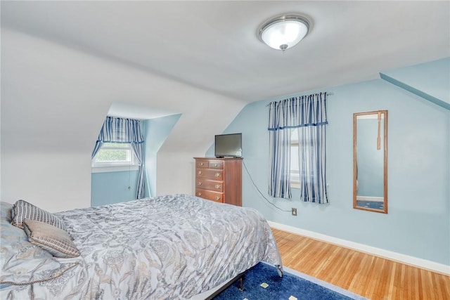 350 Colebourne Rd, Rochester, NY 14609 - bedroom with wood finished floors, lofted ceiling, and baseboards