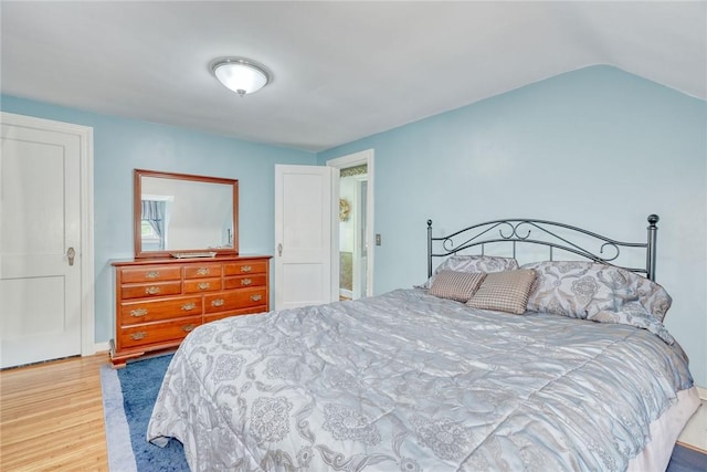 350 Colebourne Rd, Rochester, NY 14609 - bedroom featuring wood finished floors and vaulted ceiling