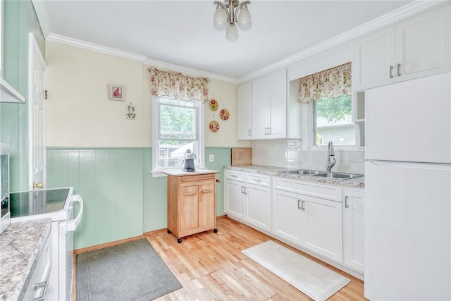 350 Colebourne Rd, Rochester, NY 14609 - kitchen with white appliances, a sink, plenty of natural light, light countertops, and crown molding