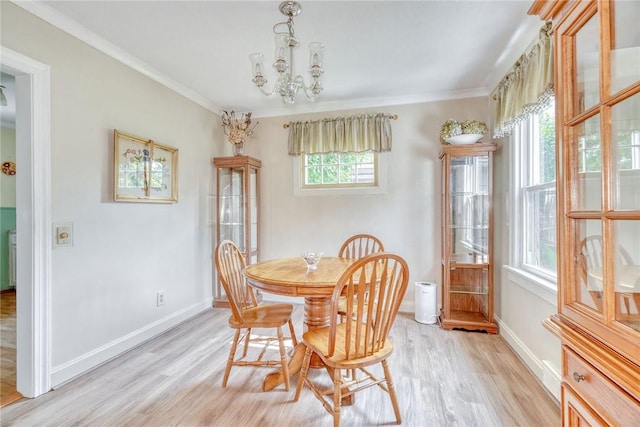 350 Colebourne Rd, Rochester, NY 14609 - dining room featuring ornamental molding, light wood-style floors, plenty of natural light, a chandelier, and baseboards