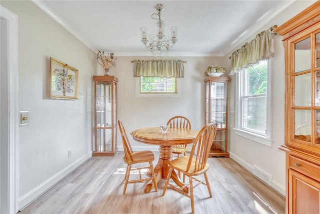 350 Colebourne Rd, Rochester, NY 14609 - dining room featuring light wood finished floors, a chandelier, plenty of natural light, baseboards, and crown molding