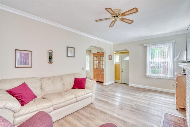 350 Colebourne Rd, Rochester, NY 14609 - living area with arched walkways, a ceiling fan, crown molding, light wood-style flooring, and baseboards