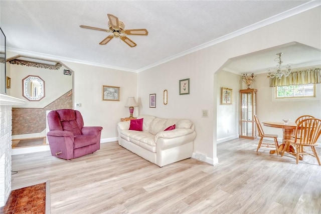 350 Colebourne Rd, Rochester, NY 14609 - living room with light wood-type flooring, arched walkways, ceiling fan, baseboards, and ornamental molding