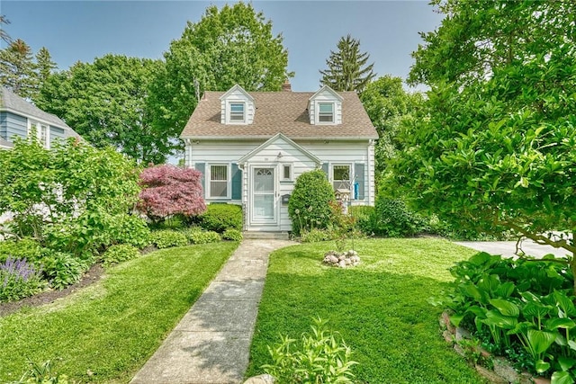 350 Colebourne Rd, Rochester, NY 14609 - cape cod house with a front lawn and a chimney