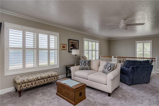 32160 State Route 12e, Cape Vincent, NY 13618 - carpeted living area featuring a ceiling fan, ornamental molding, and baseboards