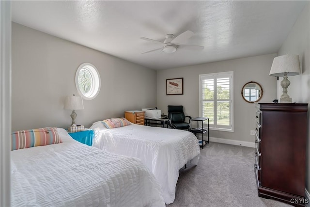 32160 State Route 12e, Cape Vincent, NY 13618 - bedroom featuring light colored carpet, baseboards, and a ceiling fan