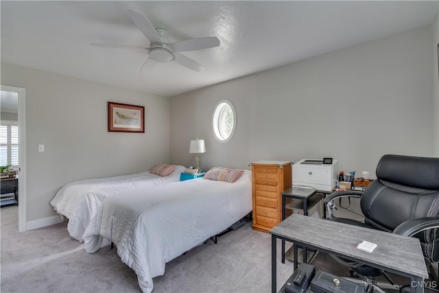 32160 State Route 12e, Cape Vincent, NY 13618 - bedroom with light carpet, multiple windows, an office area, and a ceiling fan