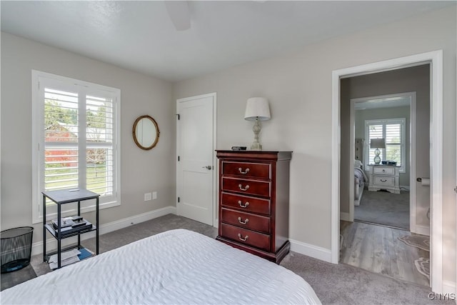 32160 State Route 12e, Cape Vincent, NY 13618 - carpeted bedroom with baseboards and a ceiling fan