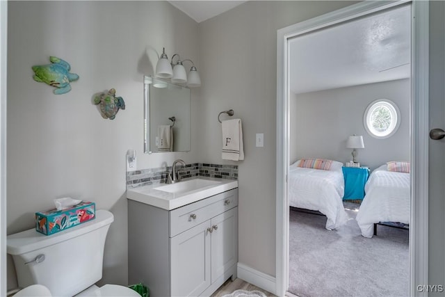 32160 State Route 12e, Cape Vincent, NY 13618 - bathroom with connected bathroom, vanity, and toilet