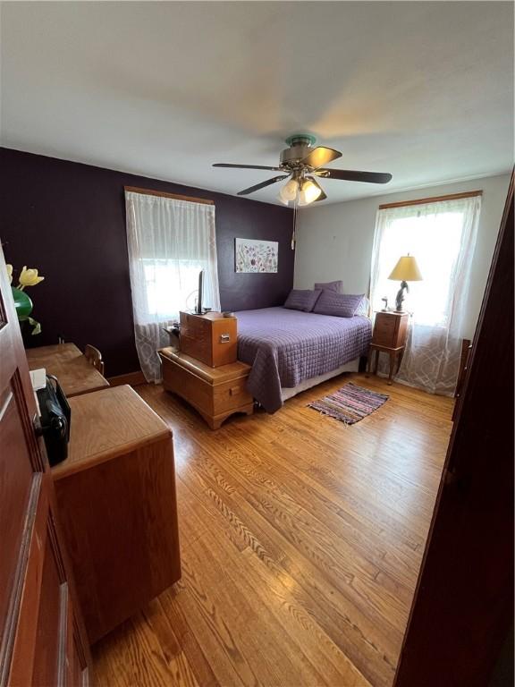 1214 S Main, Southport, NY 14904 - bedroom with light wood-style floors and ceiling fan