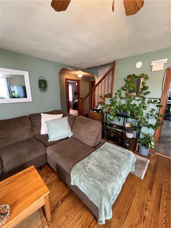 1214 S Main, Southport, NY 14904 - living area with arched walkways, a ceiling fan, wood finished floors, and stairs