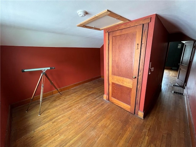 1214 S Main, Southport, NY 14904 - bonus room featuring lofted ceiling, hardwood / wood-style flooring, and baseboards