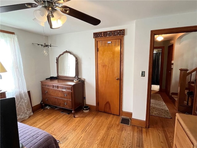 1214 S Main, Southport, NY 14904 - bedroom featuring light wood finished floors, baseboards, ceiling fan, and arched walkways